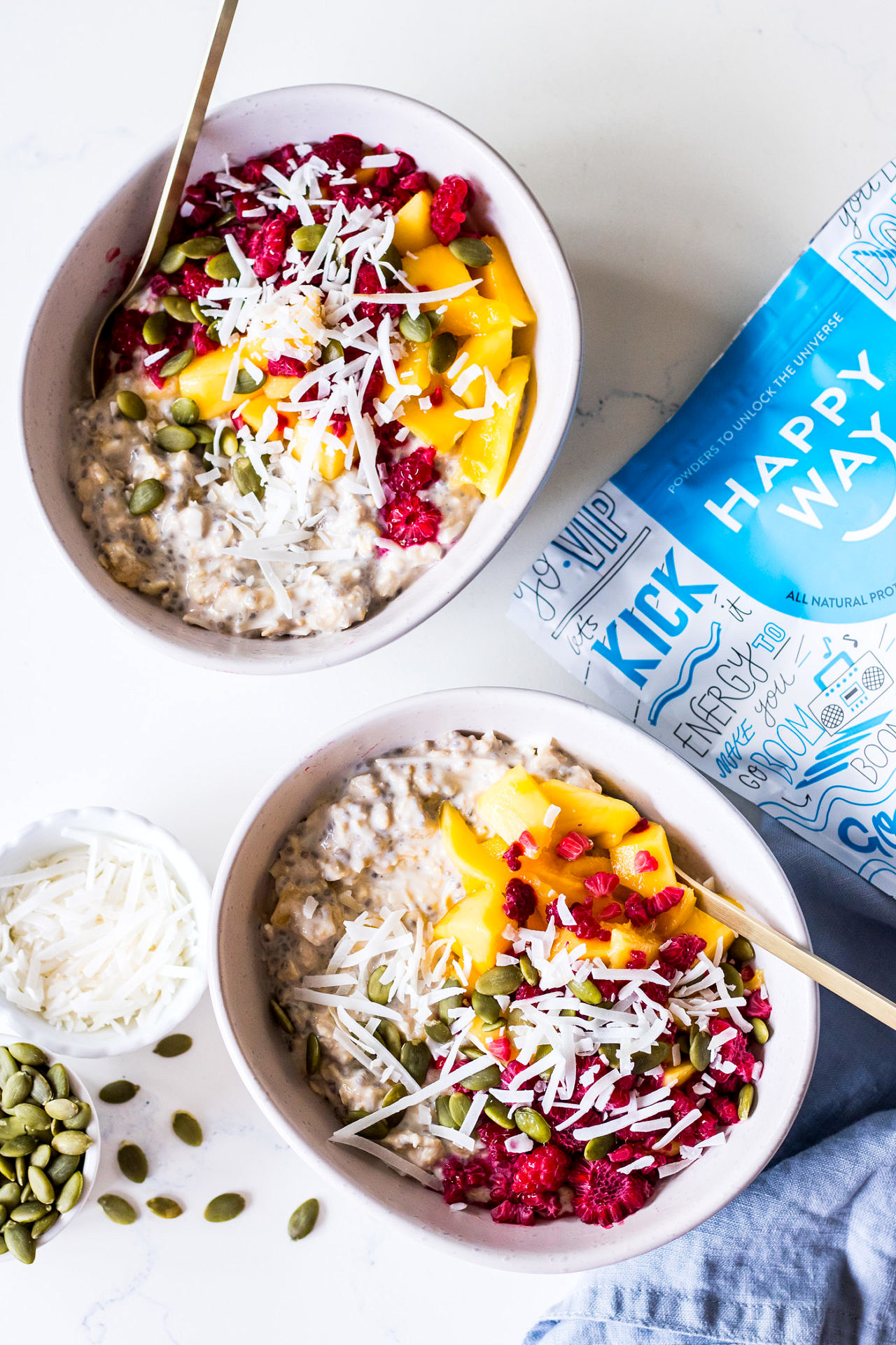 Overnight oats with mango, coconut and raspberries, vanilla protein powder packet
