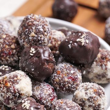 Cranberry and date healthy chocolate truffles made with cacao and medjool dates