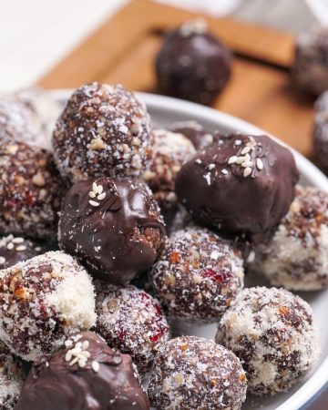Cranberry and date healthy chocolate truffles made with cacao and medjool dates