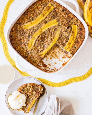 Baked banana zucchini oatmeal in a square white baking dish