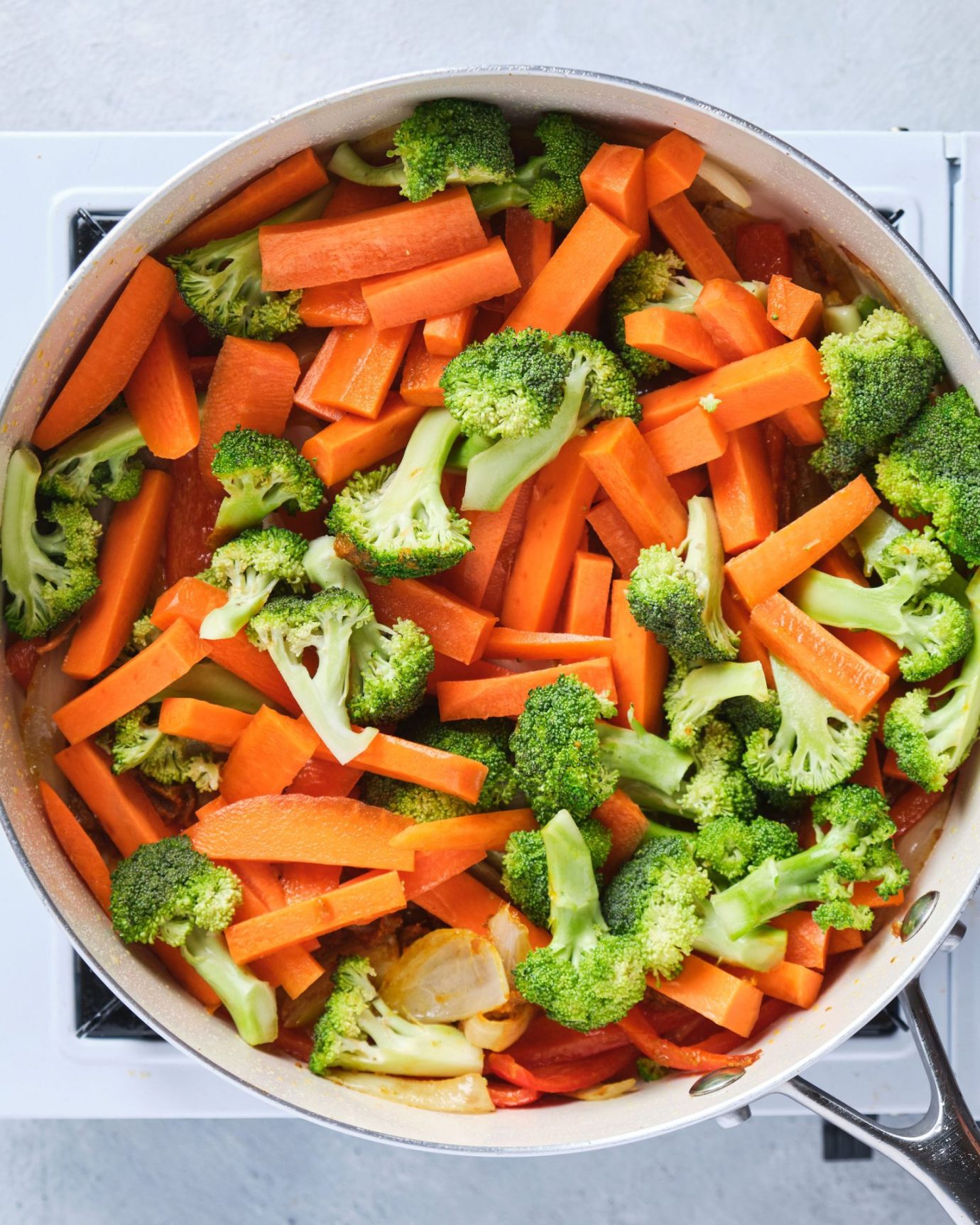 Chopped vegetables cooking in a frypan