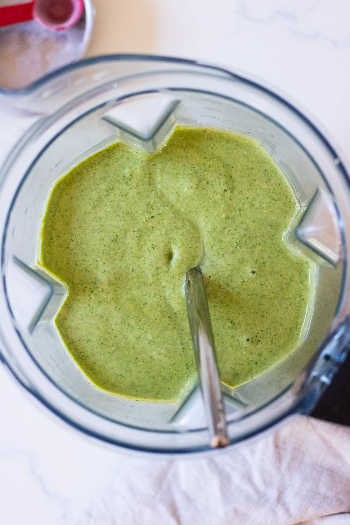 Image of green pancake batter in a blender jug