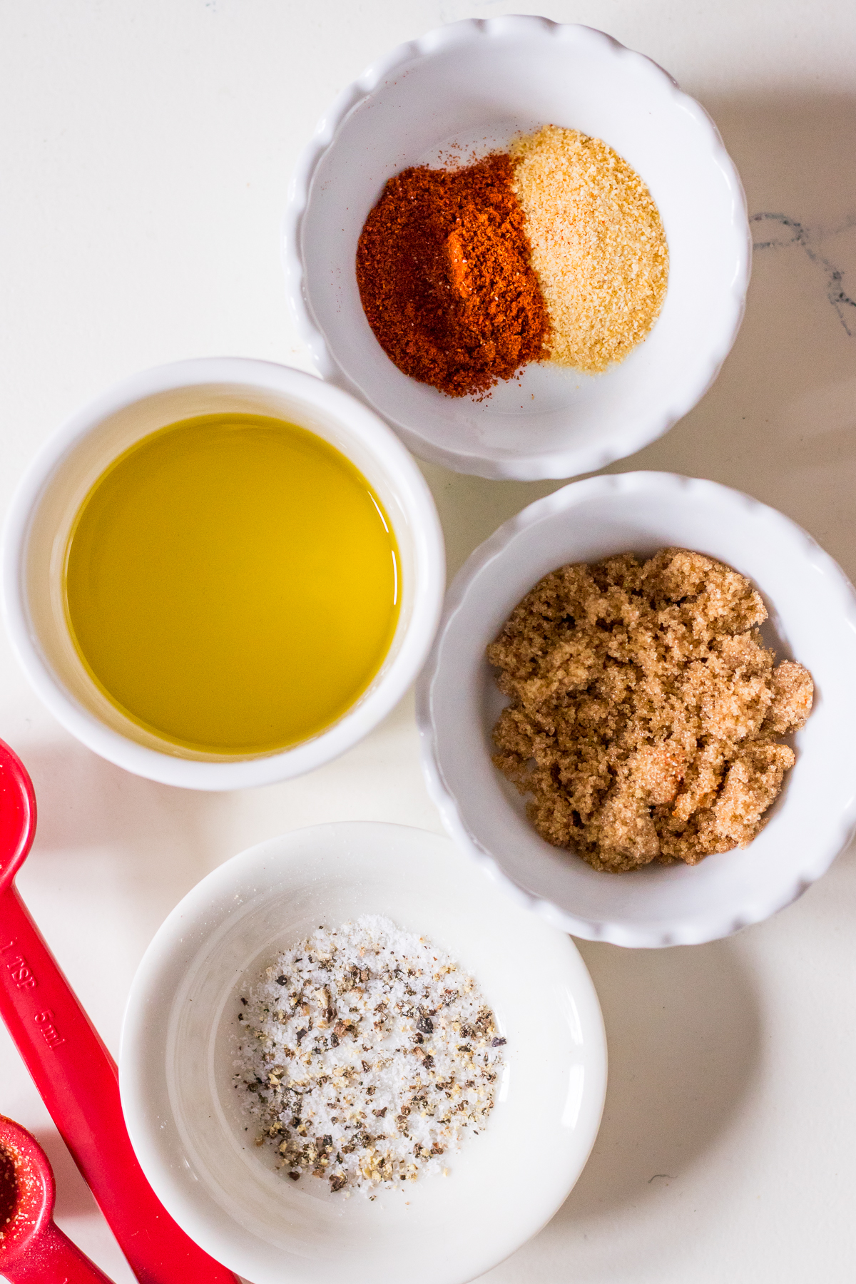Image of small dishes filled with smoked paprika, garlic, olive oil and brown sugar