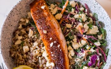 Image of brown sugar glazed salmon fillet in a bowl with slaw and brown rice