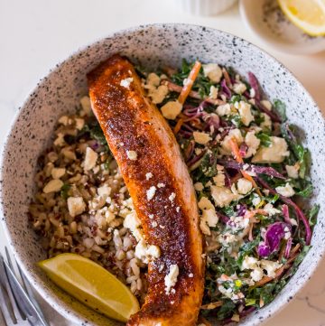 Image of brown sugar glazed salmon fillet in a bowl with slaw and brown rice