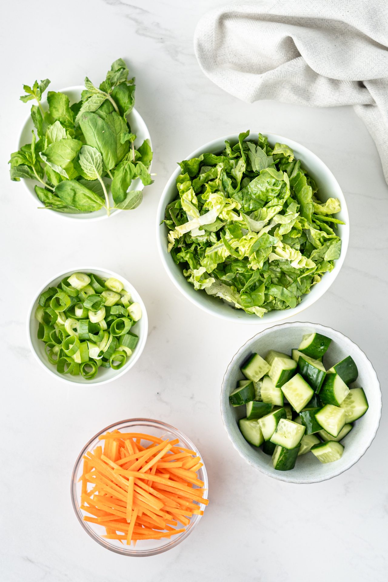 Prepared vegetables for vermicelli noodle bowls - cucumber, carrot, lettuce, spring onion, herbs | Nourish Every Day