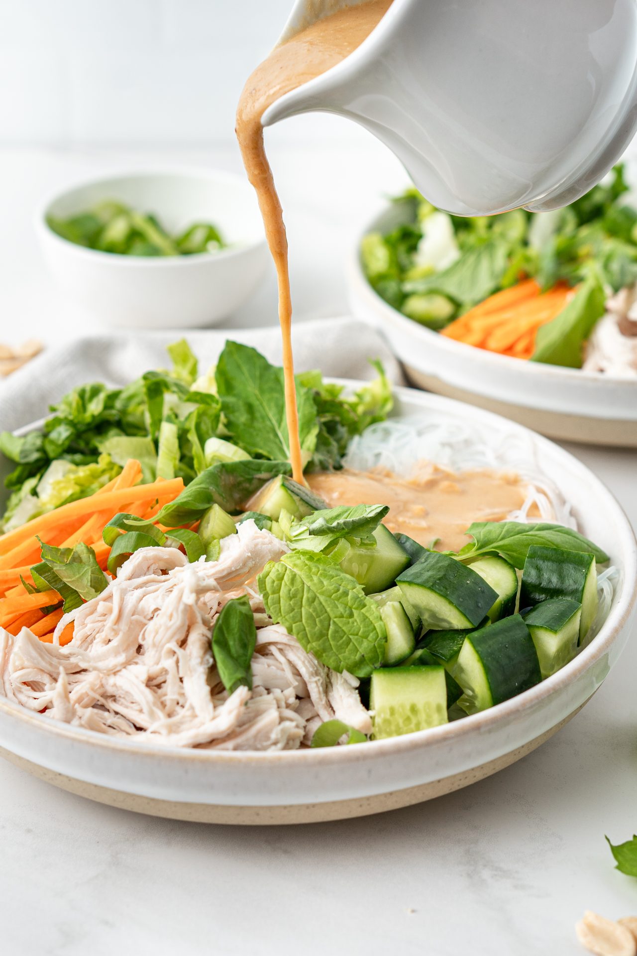 Healthy Vietnamese style vermicelli noodle bowls with salad and peanut butter sauce | Nourish Every Day
