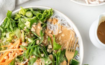 Healthy Noodle Bowls with vermicelli noodles, vegetables, fresh herbs and peanut butter sauce spread on top | Nourish Every Day