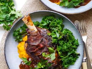 Balsamic slow cooker lamb shanks made with dried thyme and a rich flavoursome tomato sauce. Gluten free, dairy free and really easy to make! Recipe at wordpress-6440-15949-223058.cloudwaysapps.com